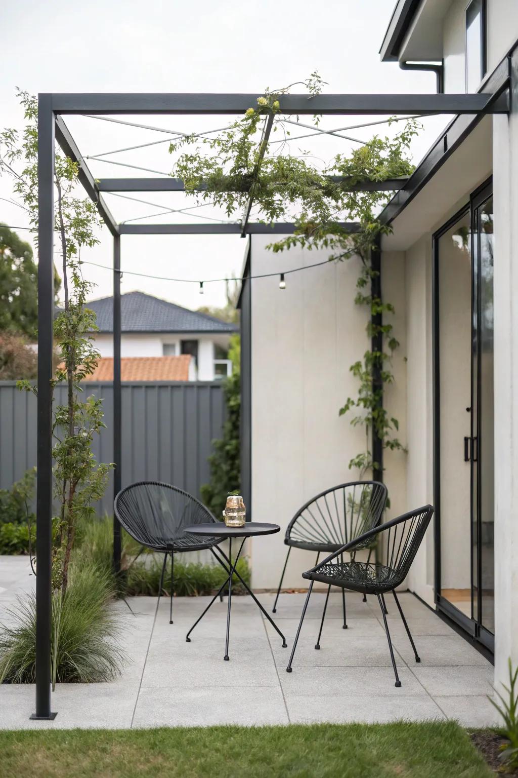 An understated metal pergola contributes contemporary elegance to a small patio.