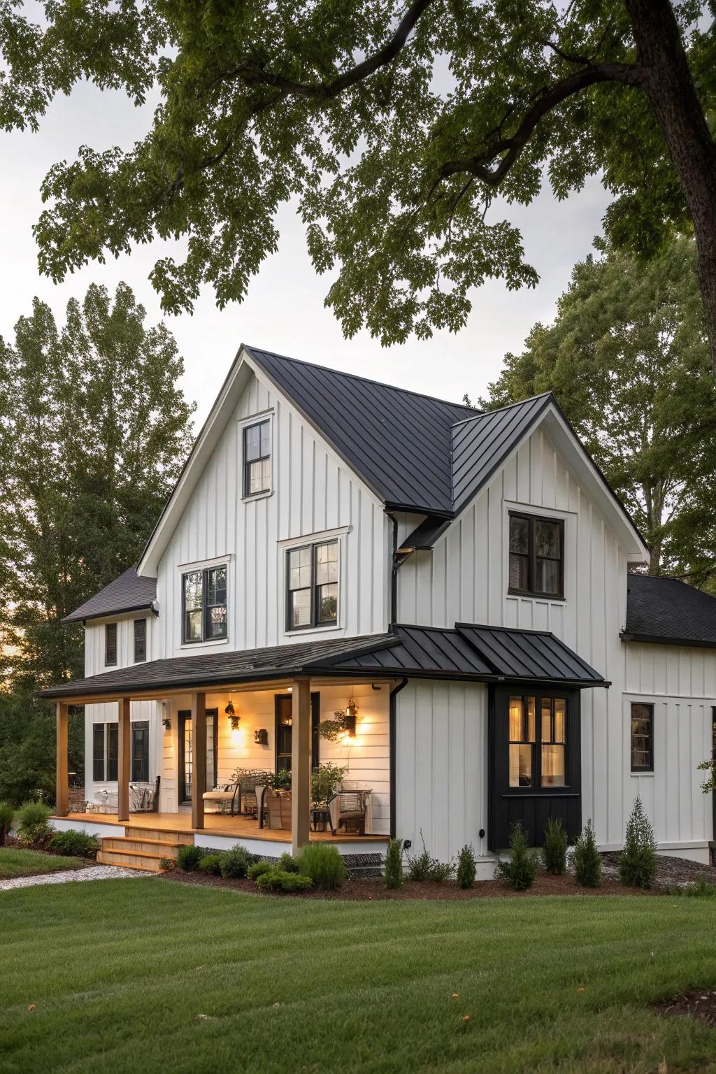 A modern farmhouse featuring light siding and dark features.