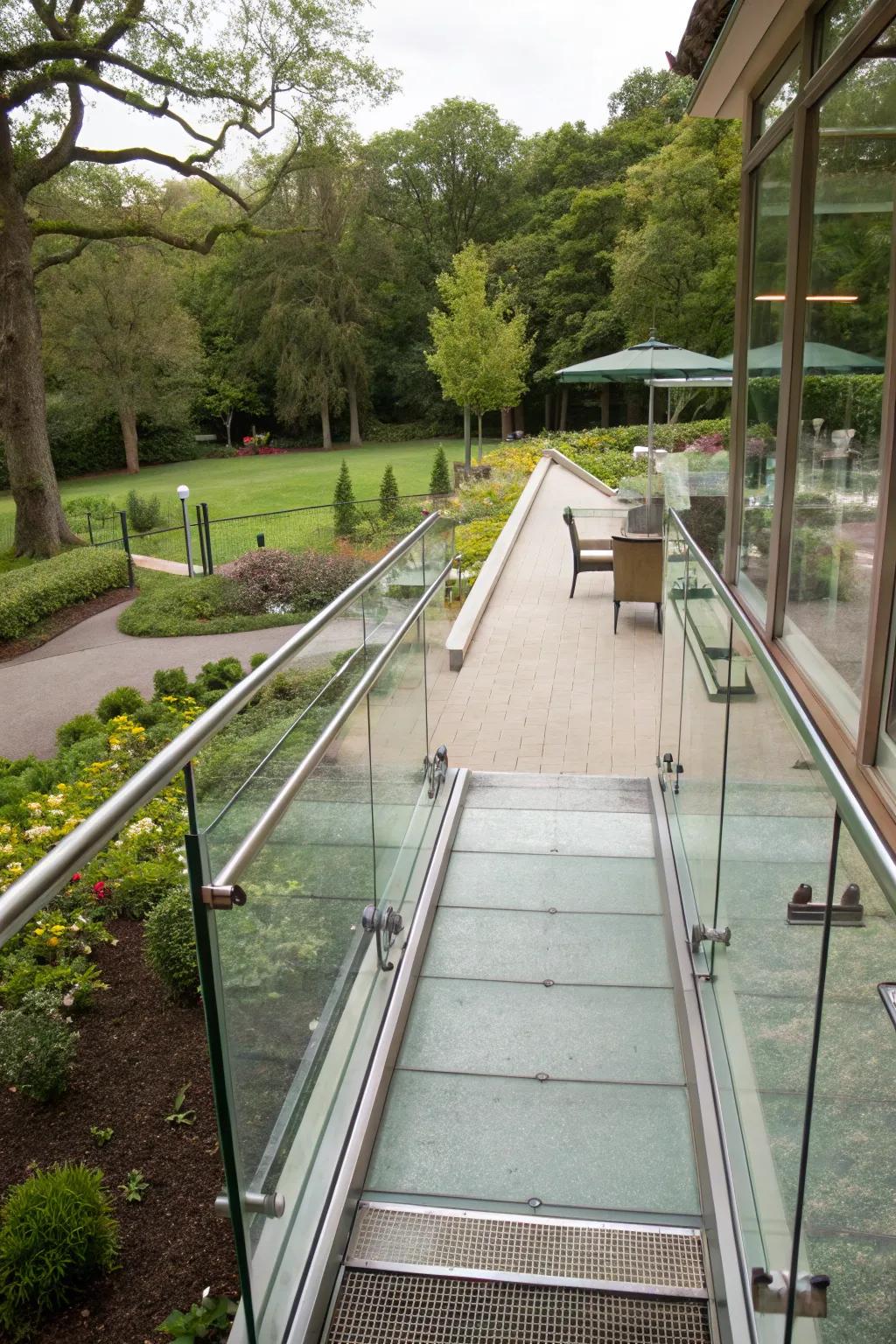 A ramp with transparent railings that keeps the view open and airy.