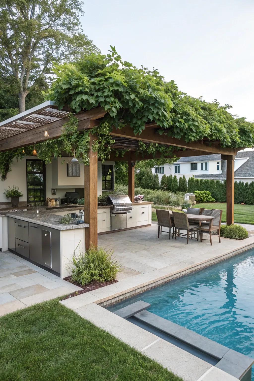 Pergola with outdoor cooking area improves poolside entertaining.