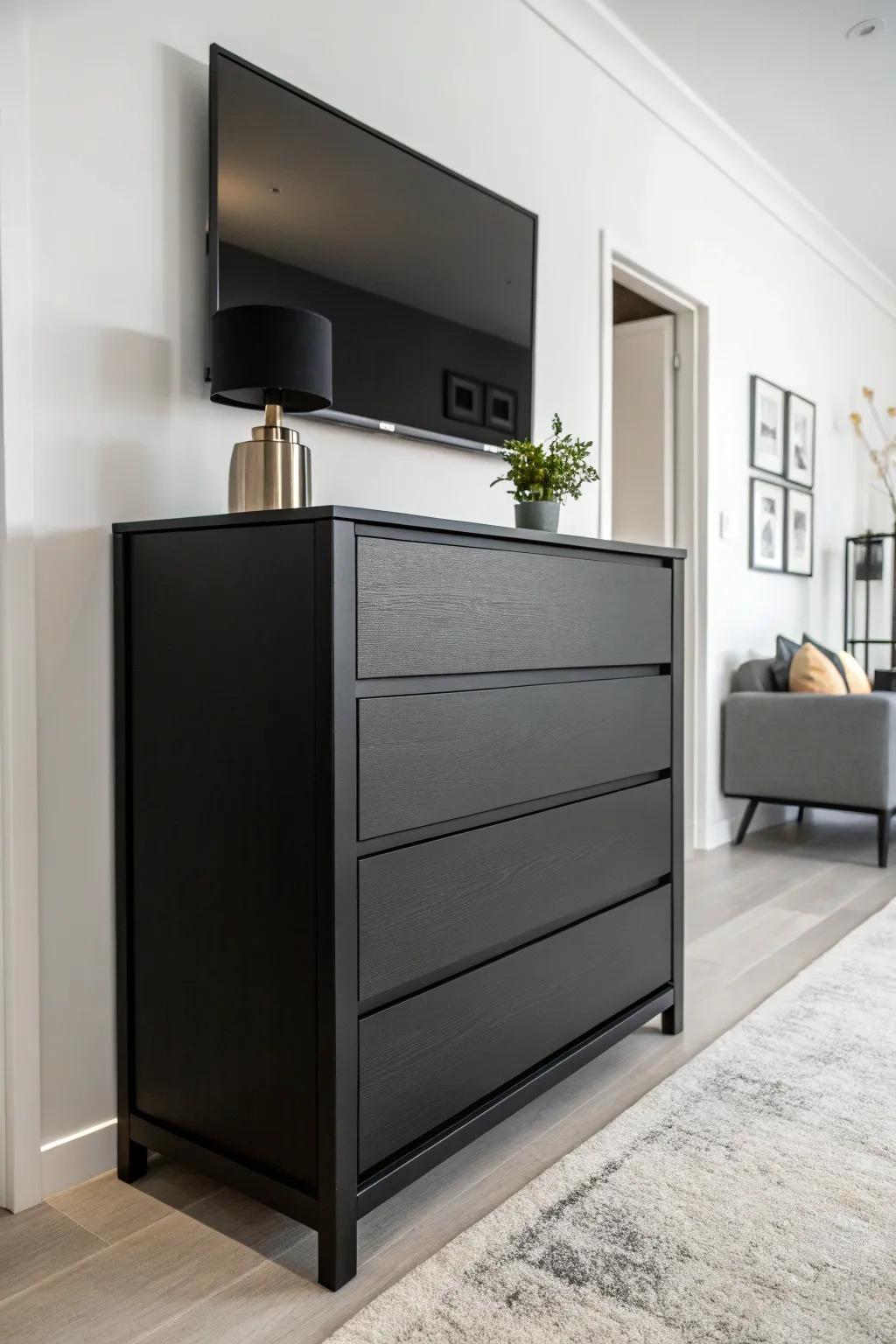 A striking contrast between a dark stained dresser and a light wall.