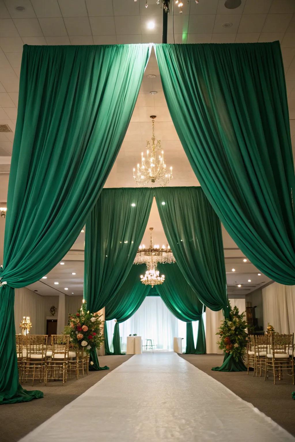 A venue transformed by elegant verdant fabric.