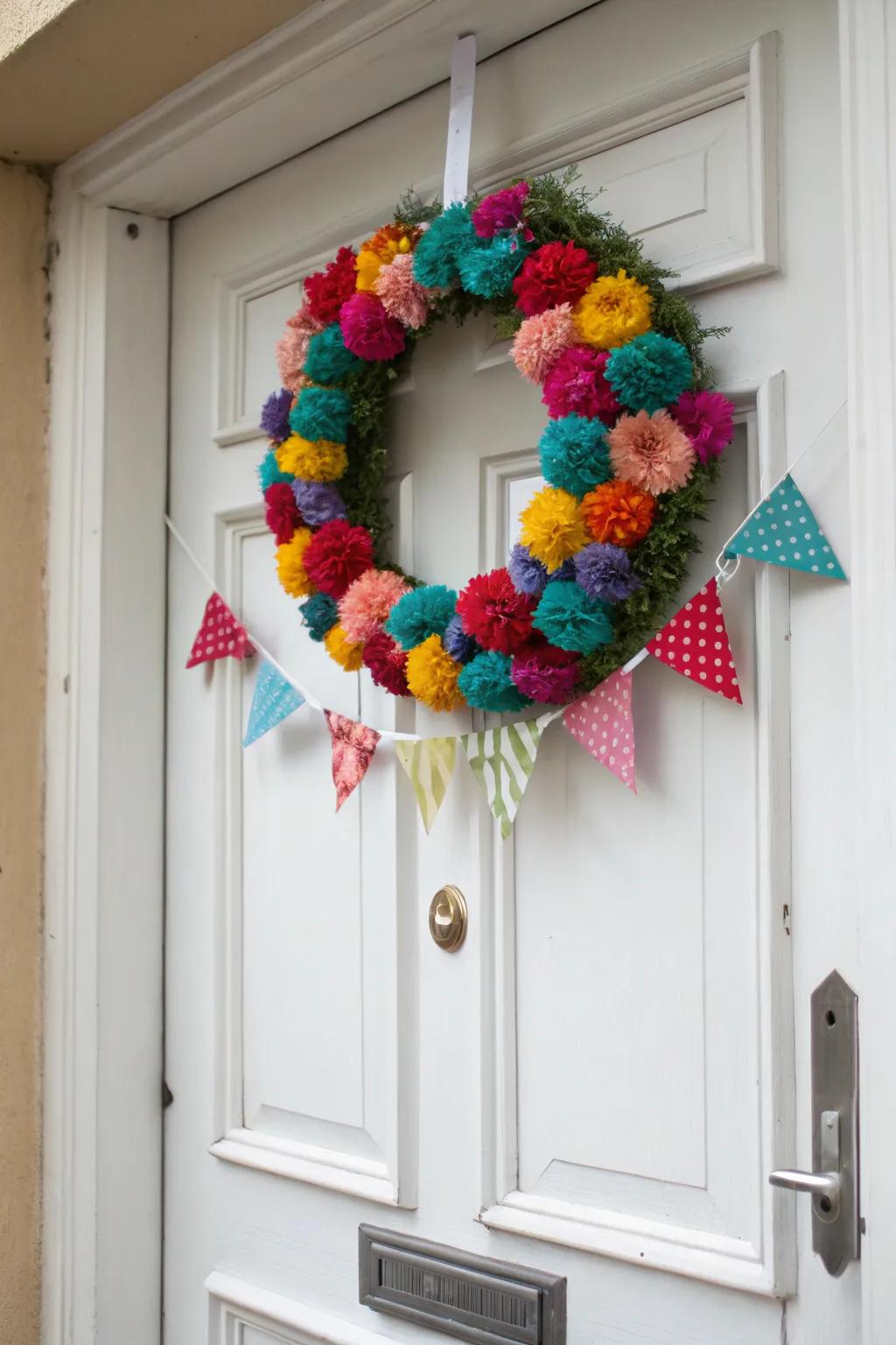 A textured and playful pom-pom and banner wreath.