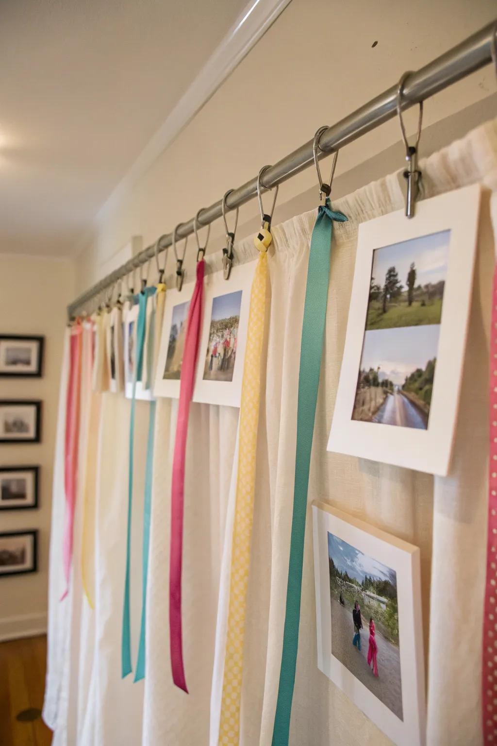 A refined display that uses curtain rods and ribbons to hang pictures.