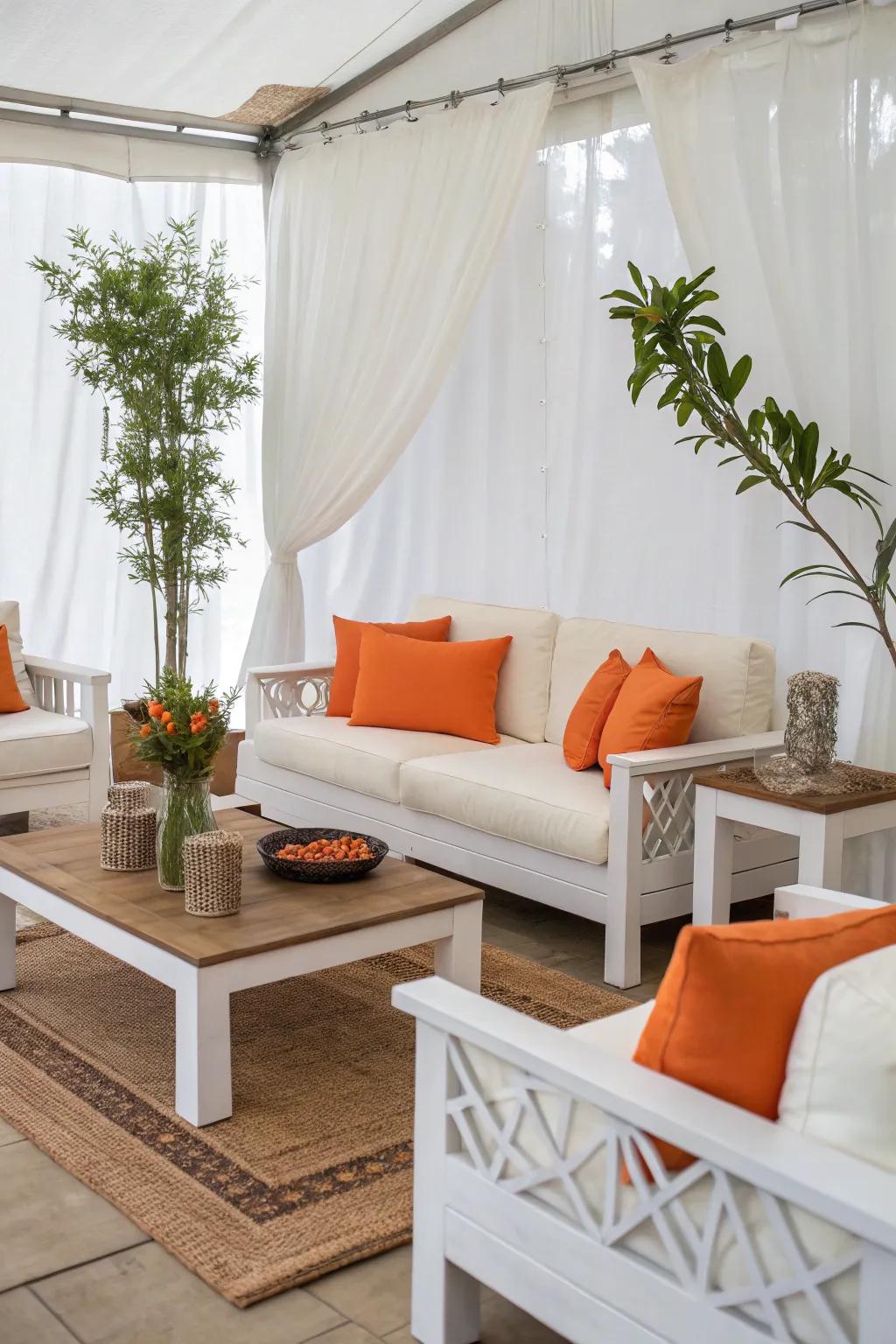 Ivory furniture paired with tangerine cushions for a chic and timeless look.