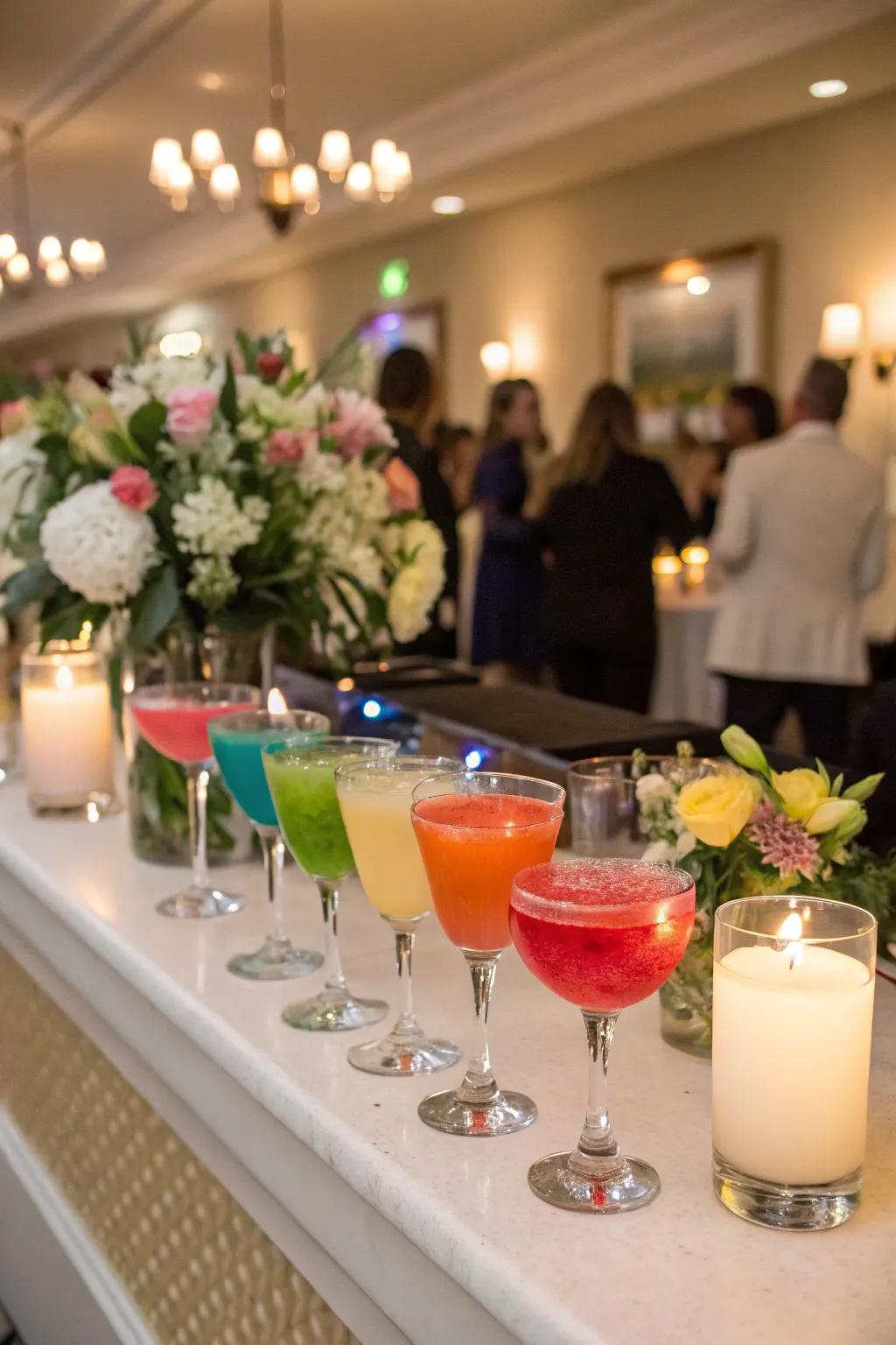 A selection of rainbow-inspired cocktails at a wedding reception.
